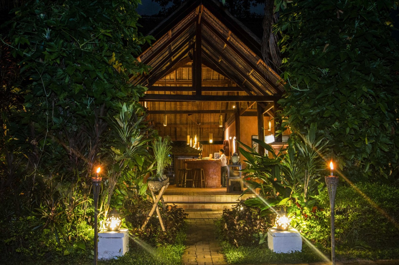 Wooden hot-spring bath overlooking the Nam Pak River at Muang La Lodge